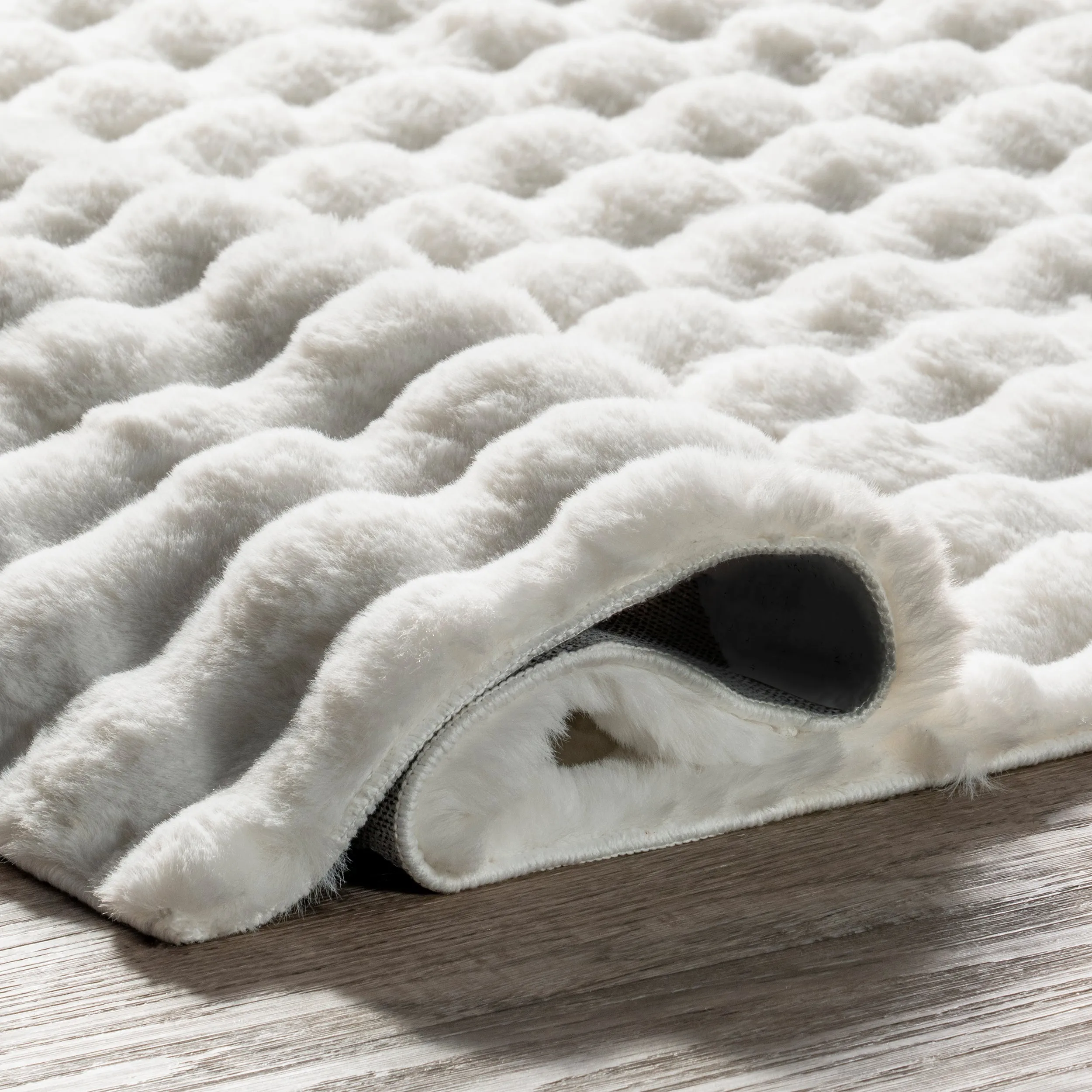 Jeni Solid Faux Rabbit Machine Washable Area Rug