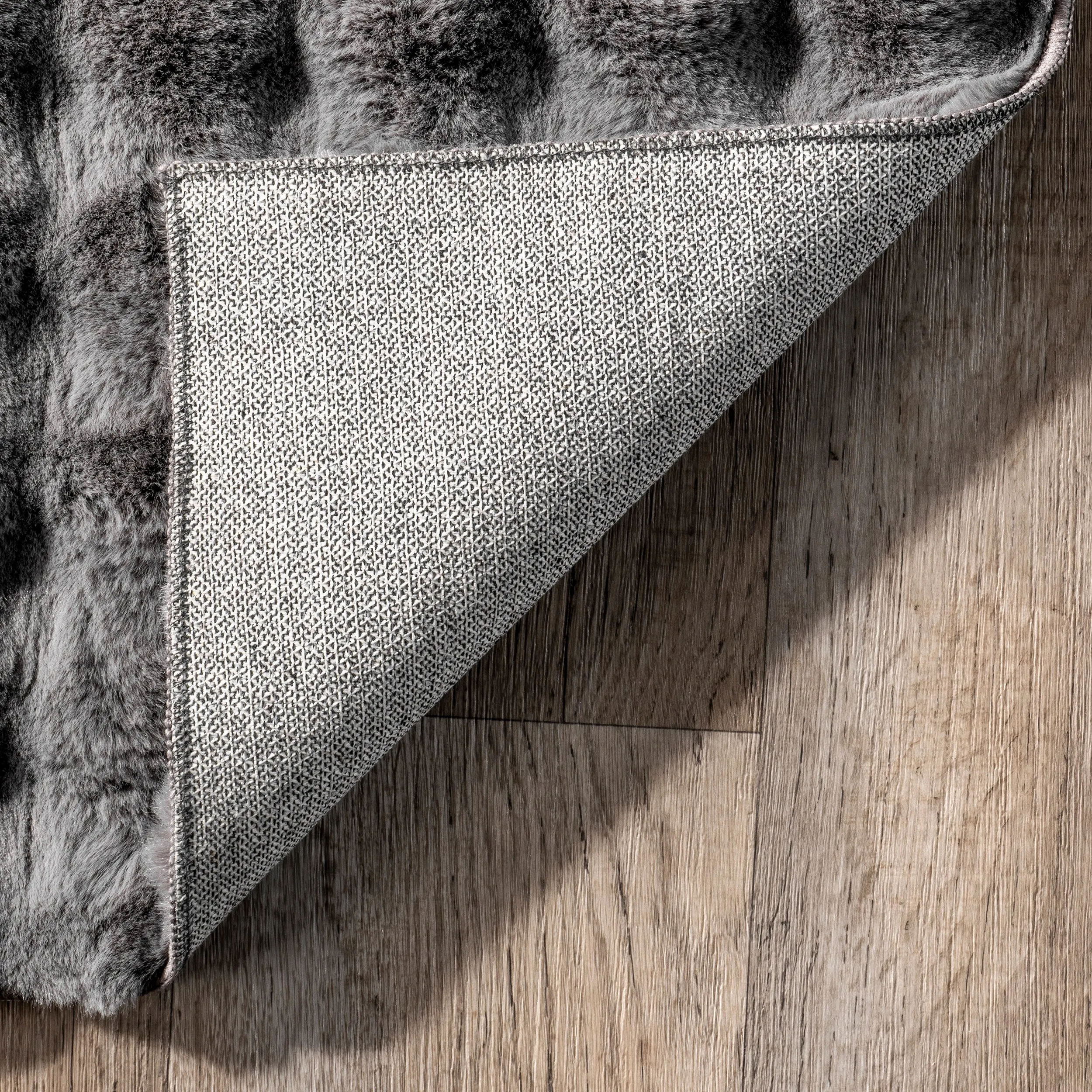 Jeni Solid Faux Rabbit Machine Washable Area Rug