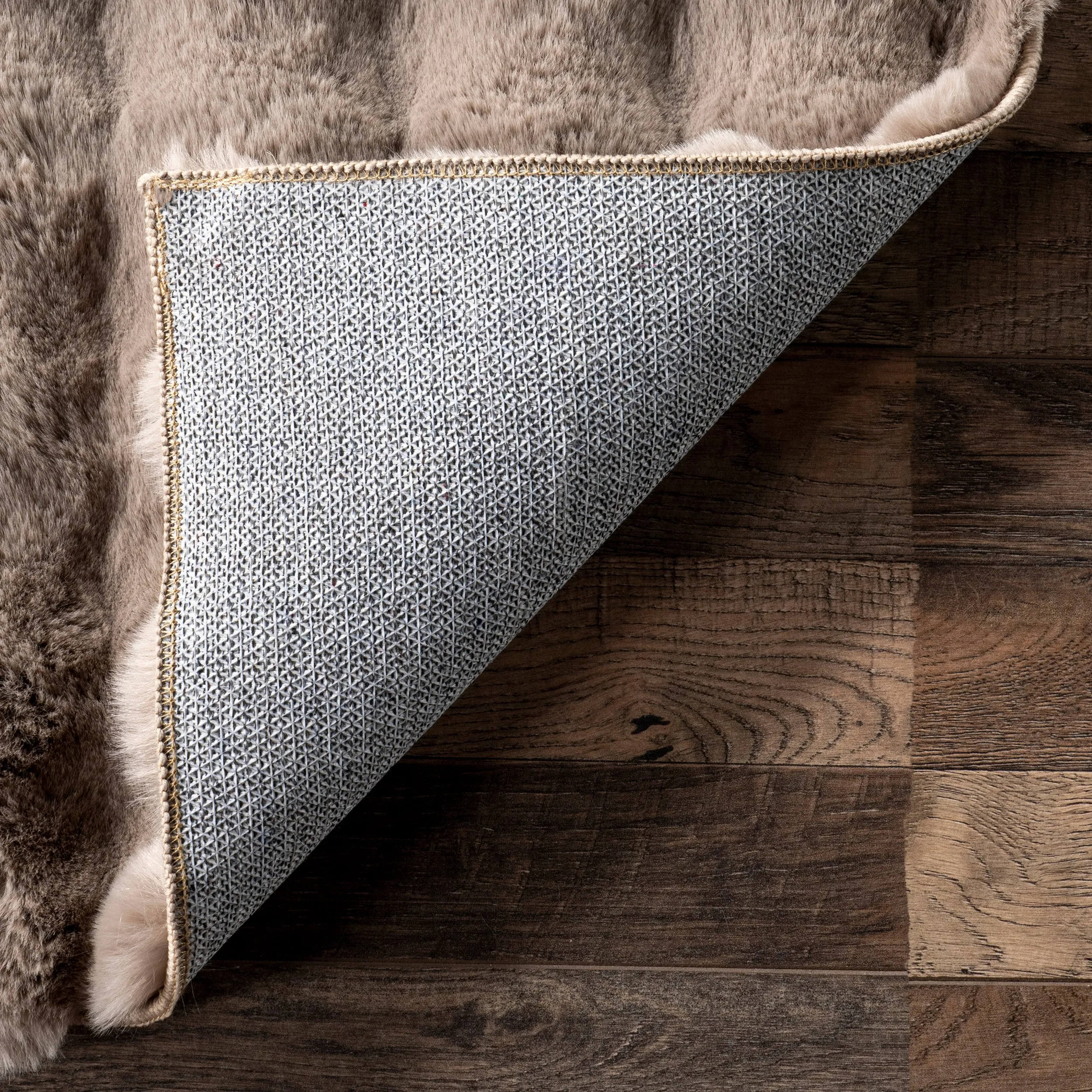 Jeni Solid Faux Rabbit Machine Washable Area Rug