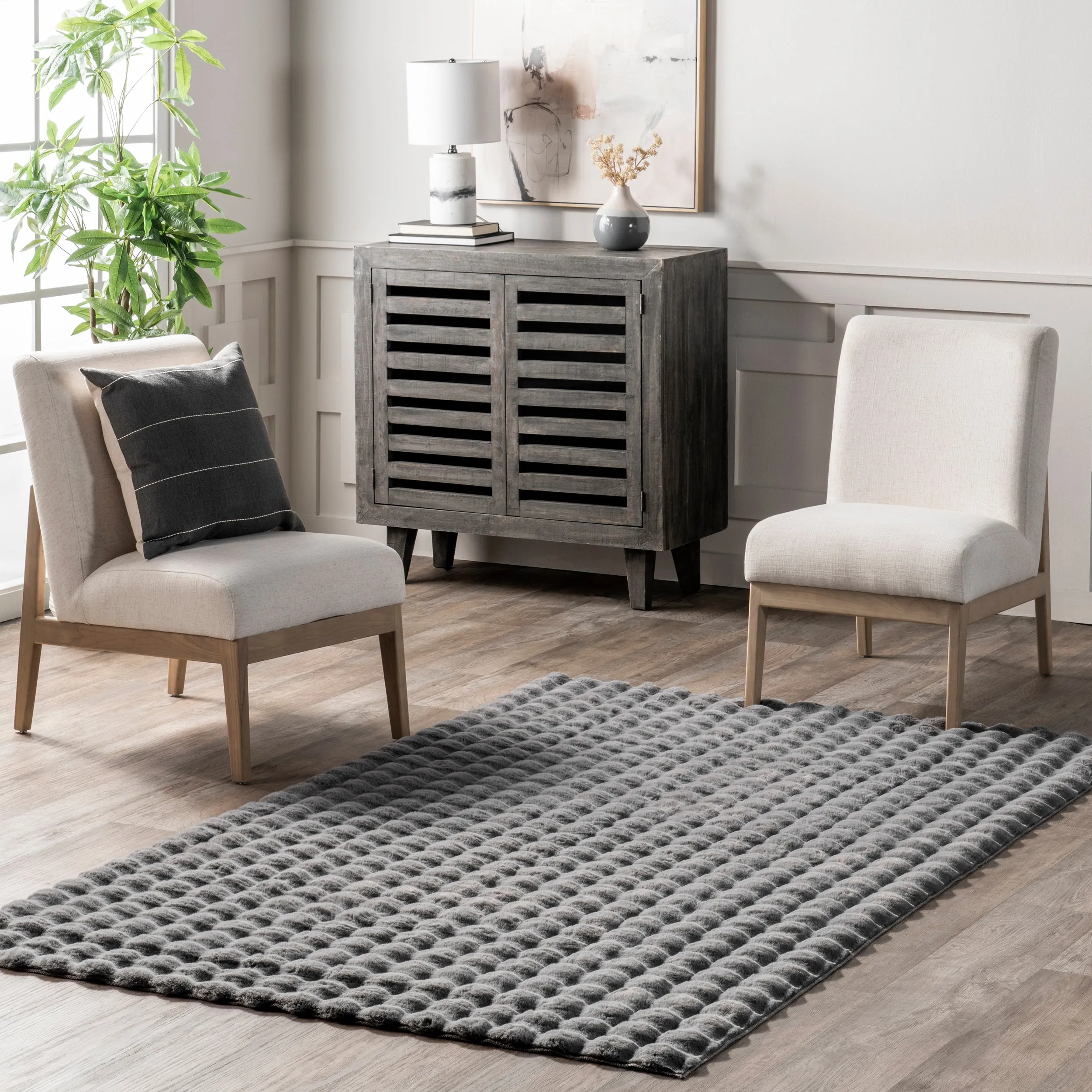 Jeni Solid Faux Rabbit Machine Washable Area Rug