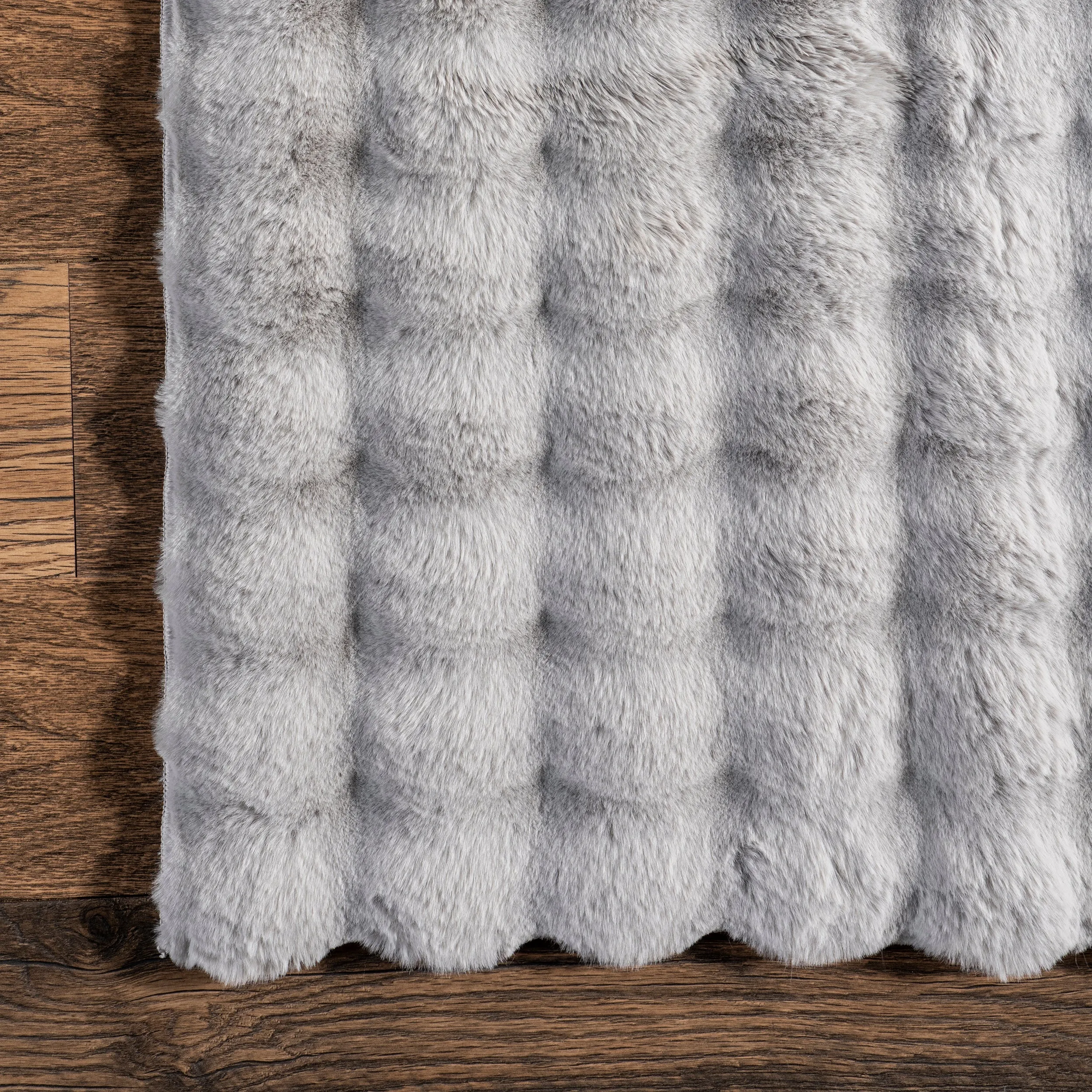 Jeni Solid Faux Rabbit Machine Washable Area Rug