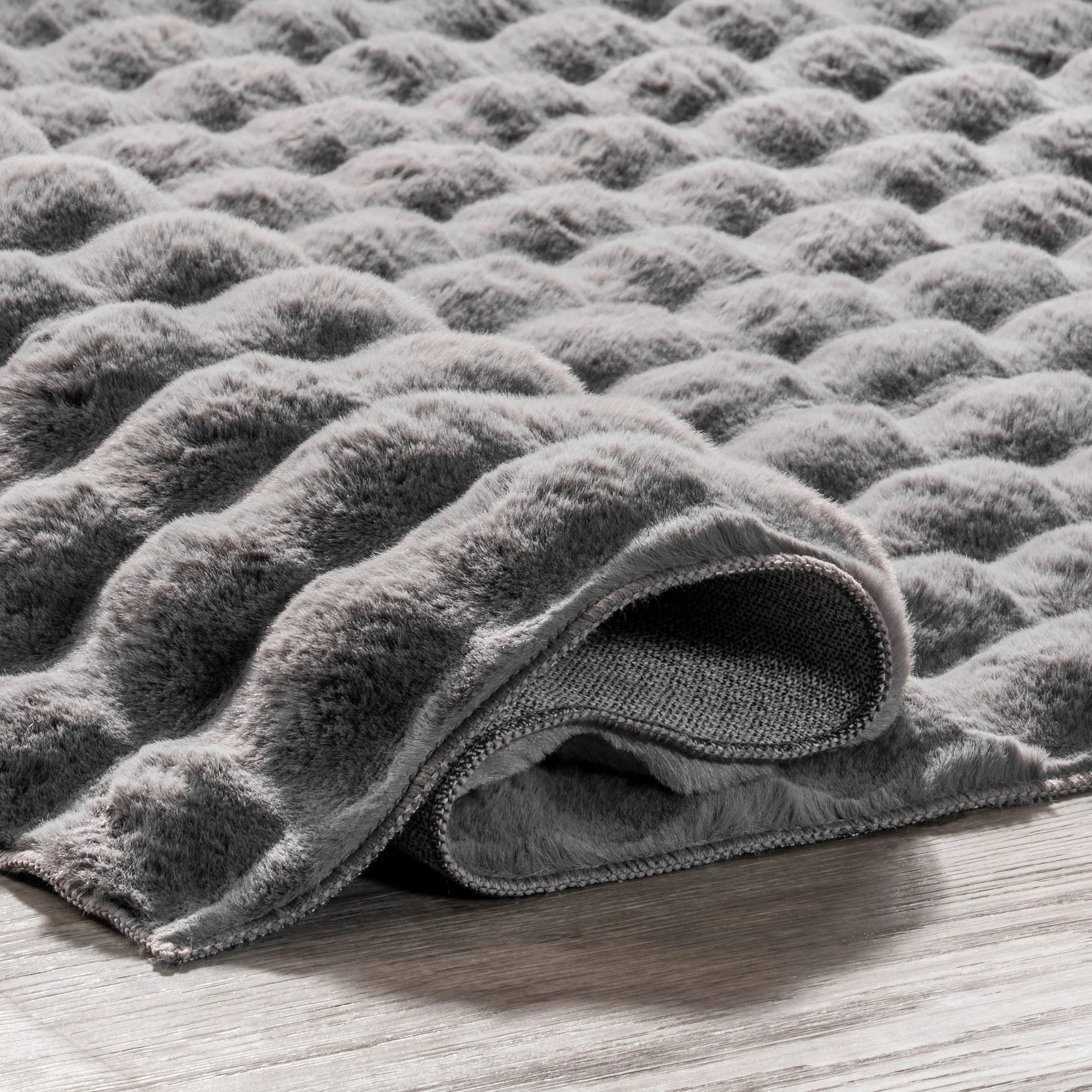 Jeni Solid Faux Rabbit Machine Washable Area Rug