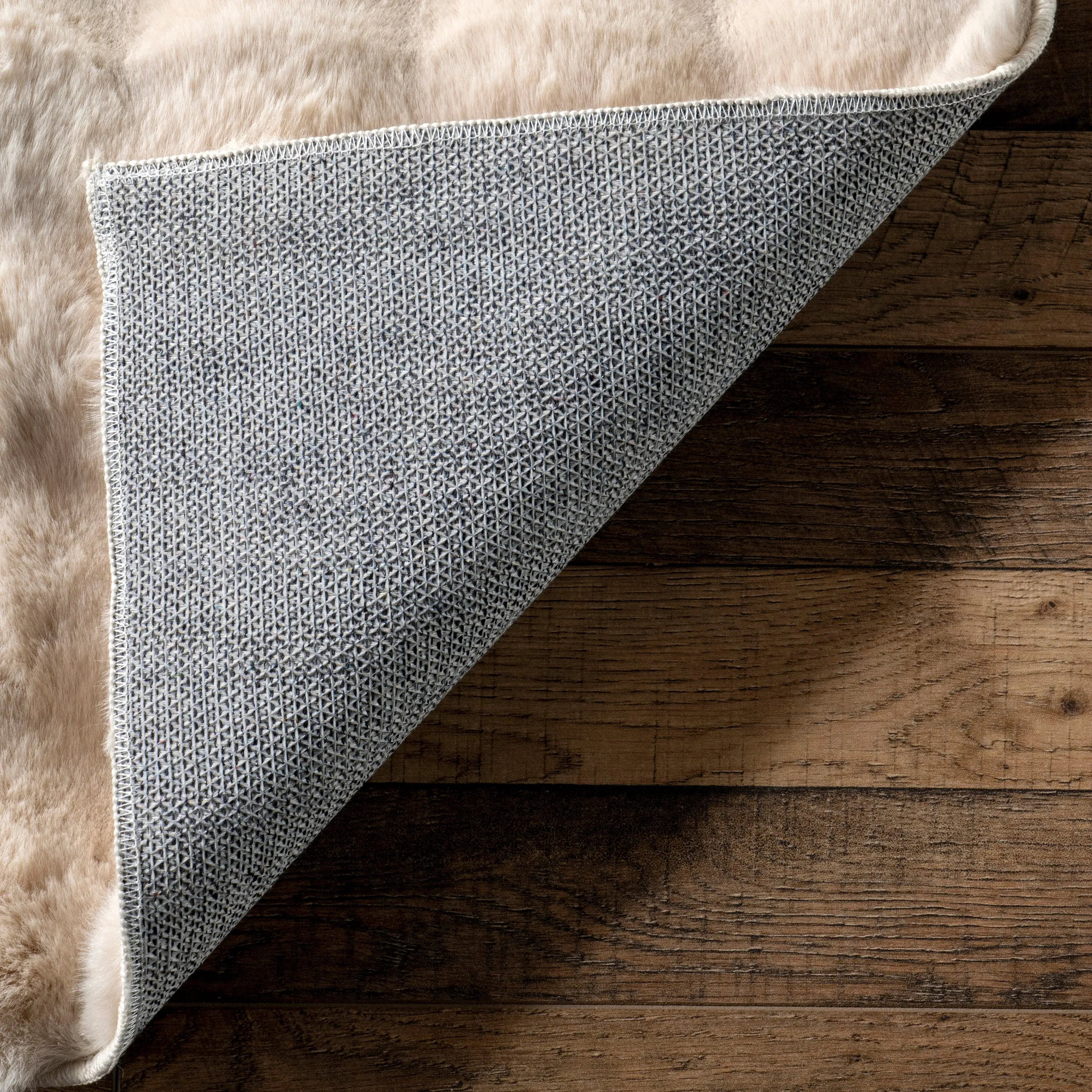 Jeni Solid Faux Rabbit Machine Washable Area Rug
