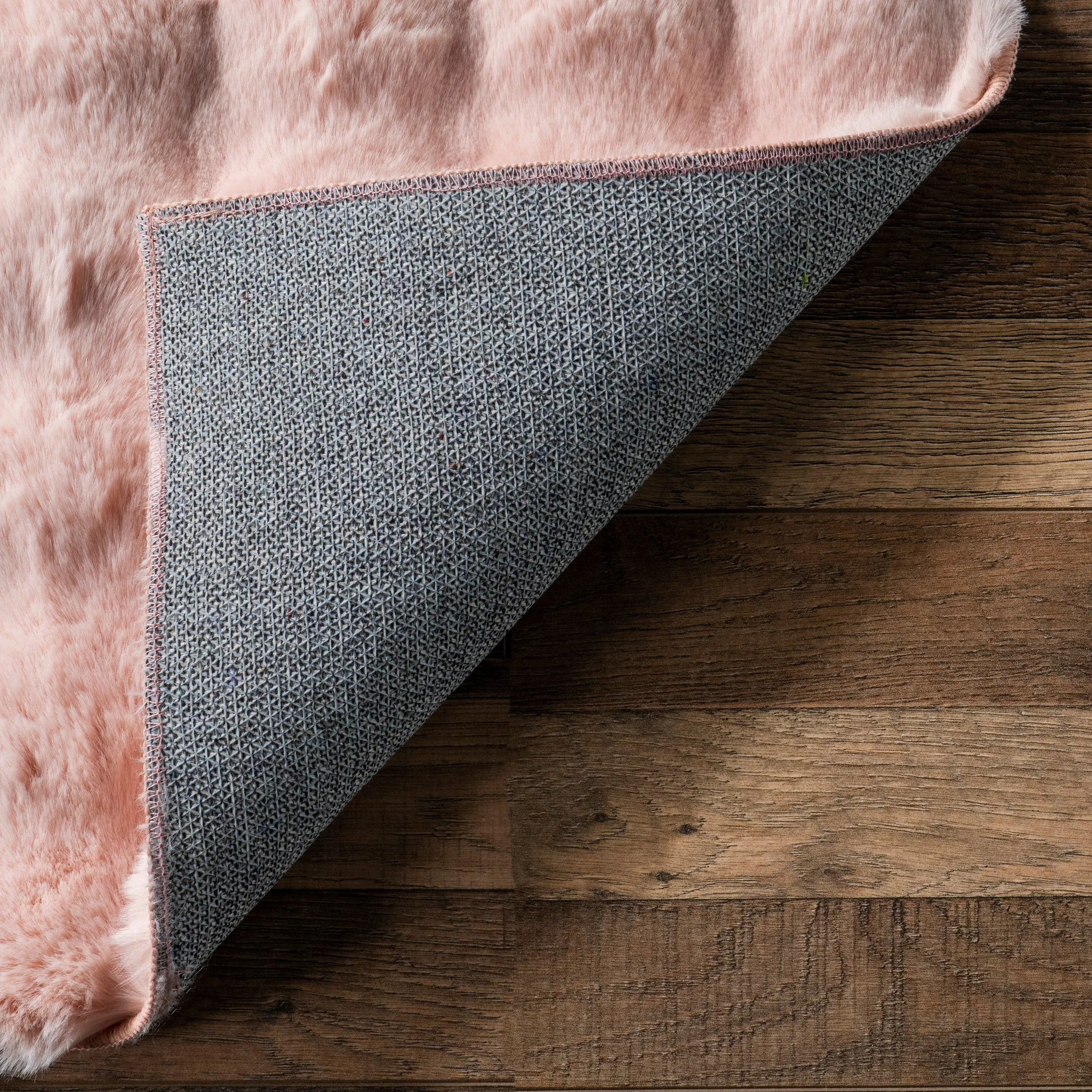 Jeni Solid Faux Rabbit Machine Washable Area Rug