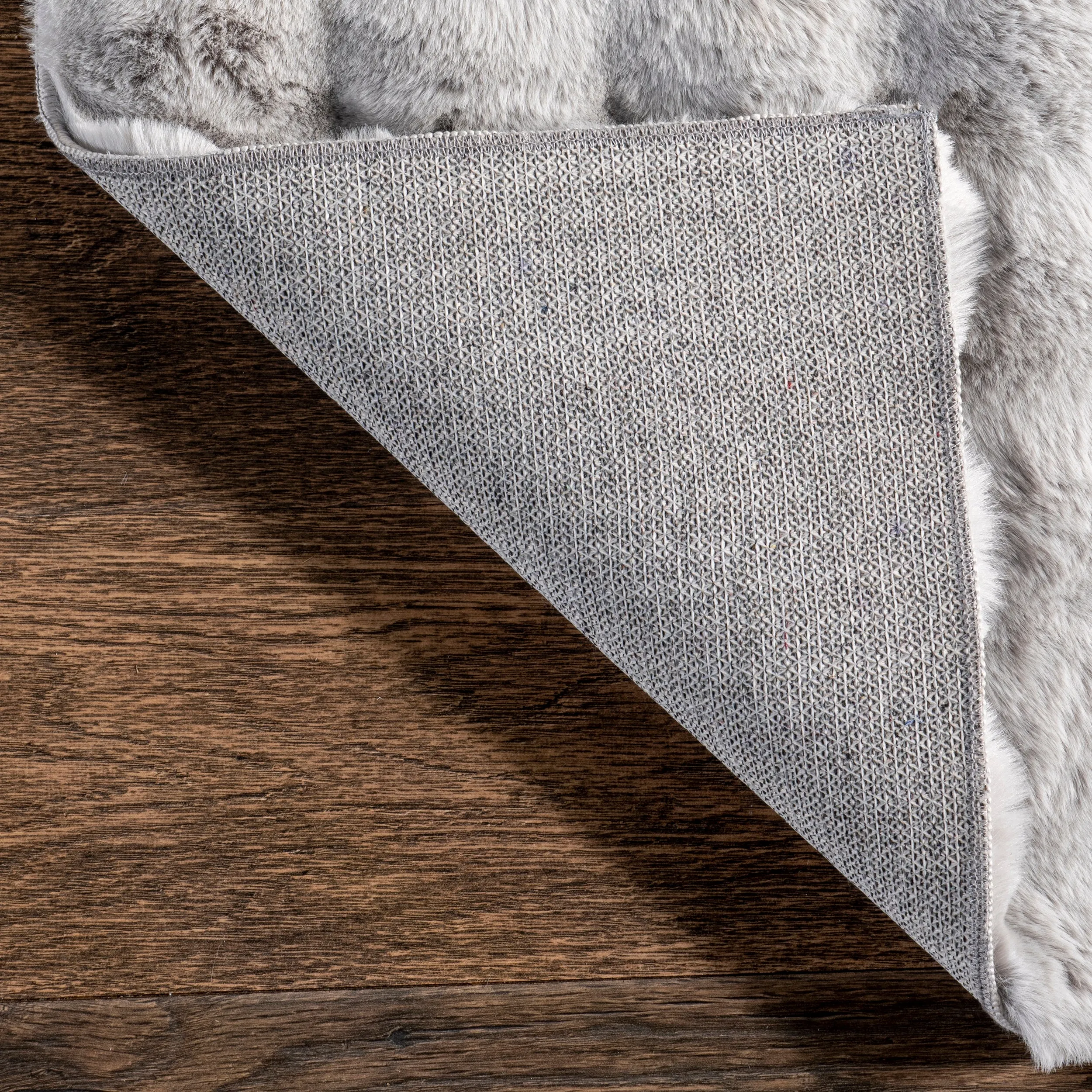 Jeni Solid Faux Rabbit Machine Washable Area Rug
