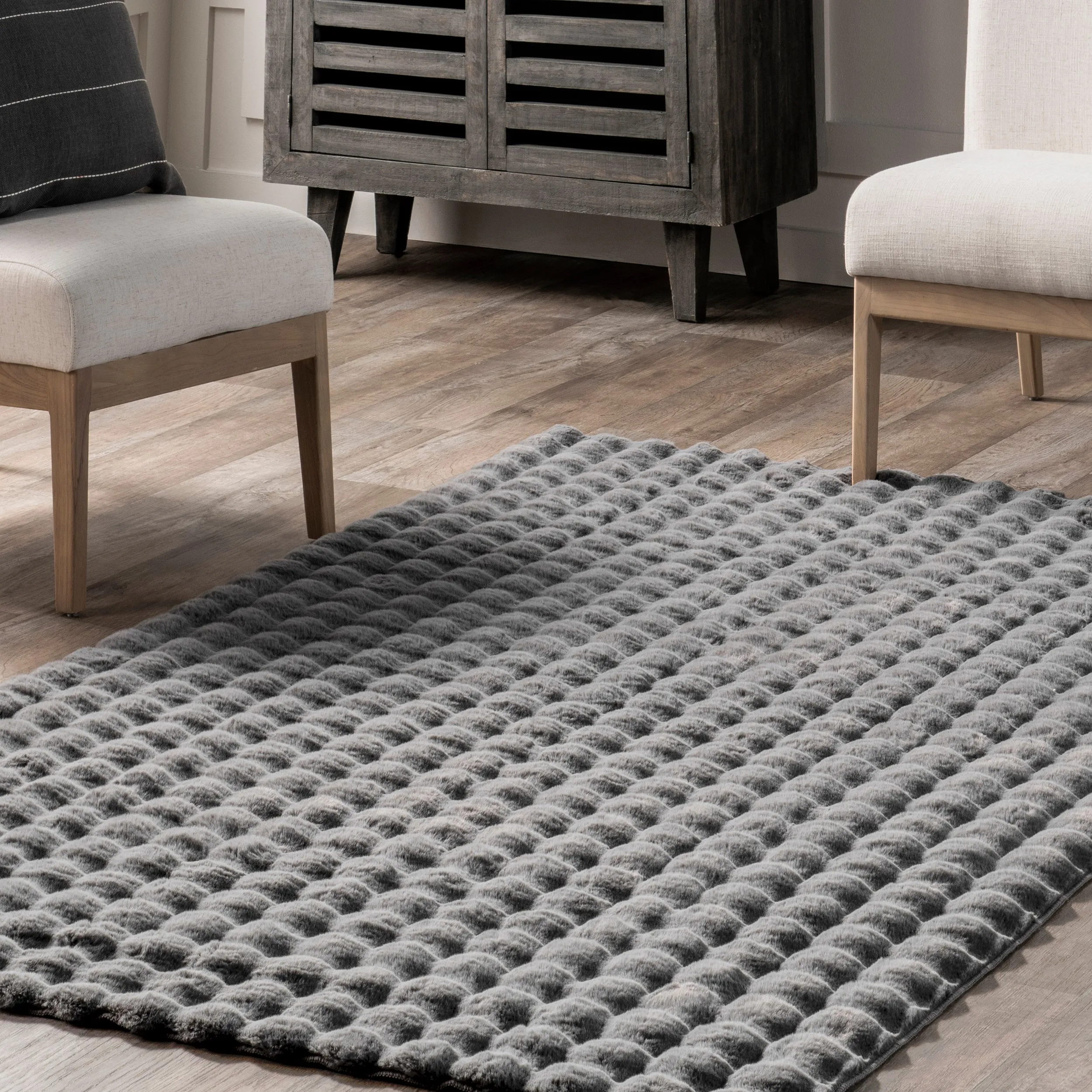 Jeni Solid Faux Rabbit Machine Washable Area Rug